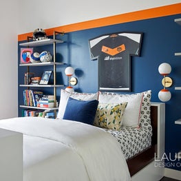 Inspired by the son's love of soccer, his favorite team colors throughout the bedroom and bath.