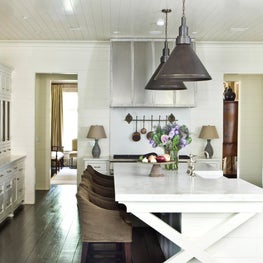Authentic kitchen with white cabinets, breakfast bar