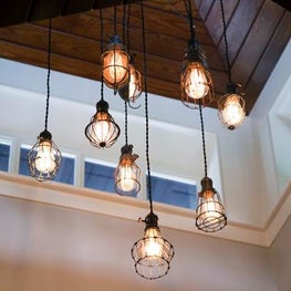 Hanging Exposed Edison Bulb Light Fixture in Double Height Great Room