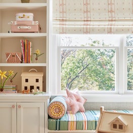 Built in window seat and bookcase with playful childrens accessories