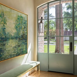 With the help of this custom steel door, guests receive a warm welcome into our Hedwig Village project.