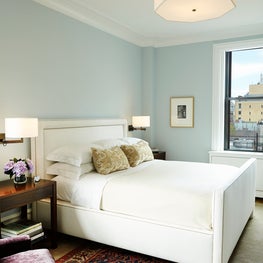 Park Avenue Residence, Bedroom w/ neutral upholstered bed and powder blue walls