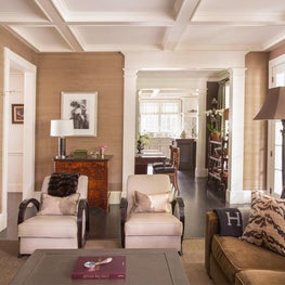 Classic Family Room with Grasscloth Walls, Coffered Ceiling and Art Deco Chairs