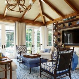 Natural wood detailing in a tropical Family Room