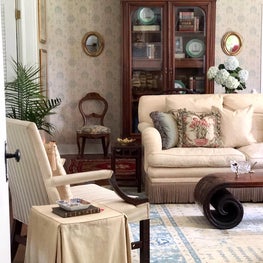 This elegant 1930's colonial cottage is overflowing with charm.  Original historic wallpapers were carefully preserved to set a pretty backdrop for antiques, family heirlooms, and personal collections.