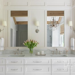 We love the decision to integrate the mirror into the millwork for a clean and sophisticated look.