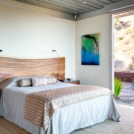 Bedroom with custom made head board and side tables. 