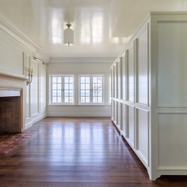 Freestanding dressing room cabinetry in a reimagined space in a historic home