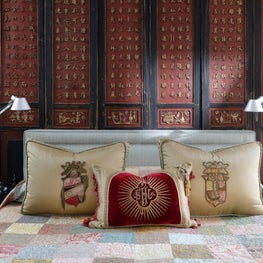 Tibetan screens, Fortuny fabric and Andy Warhol all in the Master Bedroom      