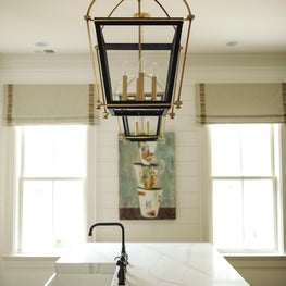 Elegant lighting fixtures with marble countertops