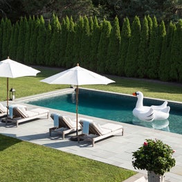 Bluestone pool and loungers in classic Hampton's weekend home