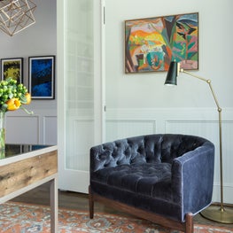 Portfolio: A vintage rug ties together a worldly art collection in a home office