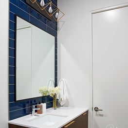 For the eldest son, we created a sophisticated and handsome space using his favorite color and love of modern design.