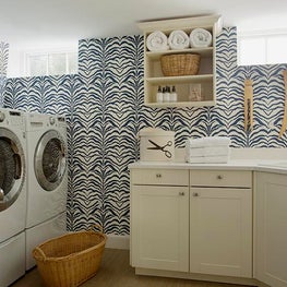 Laundry & Wash Room with Wallpaper and Built-In Cabinetry