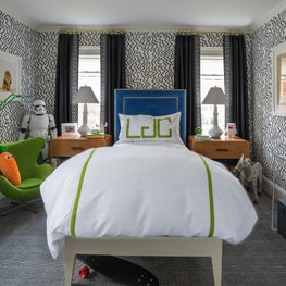 Boys Bedroom with Bright Blue Velvet Headboard and Green Monogramed Pillow
