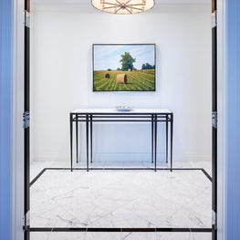 This idyllic pastoral painting is striking when placed in this modern hall.