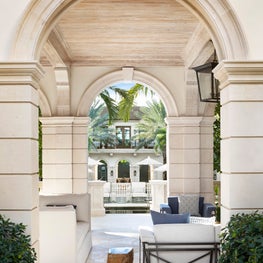 Carved limestone and bleached cypress details