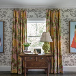Bright Window with Antique Wood console Table, and Printed Drapery Panels