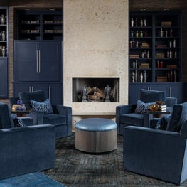 Penthouse sitting area with contemporary fireplace and vintage cocktail shakers
