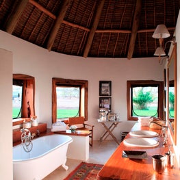 Organic bath with free-standing tub, wooden vanity