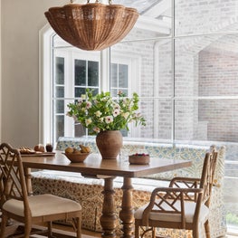 In the breakfast nook, we installed a mammoth arched window that invites natural light to shine.