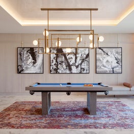 Cosmopolitan of Las Vegas - modern concrete pool table with brass chandelier