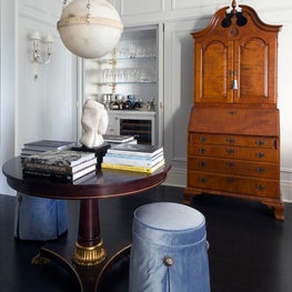 Traditional gallery room with classic armoire