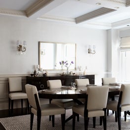 Luxurious and modern dining room with coffered ceiling and lacquered details
