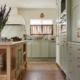 Kitchen with Pale Green Cabinets and Cipollino Tirreno Marble