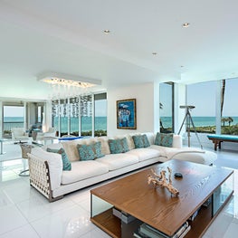 Contemporary Vacation Home with white glass floors and modern furnishings