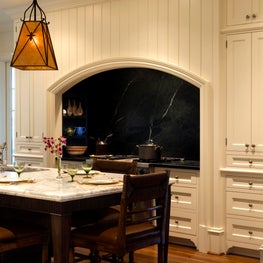 Kitchen Stove Arched Alcove with White Painted Vertical Boards