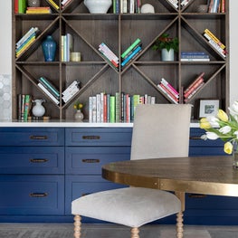 Portfolio: Breakfast area with geometric shelving and blue cabinets