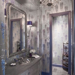 Dramatic powder room- rich blue tones, metallic wallpaper & lapis faucet