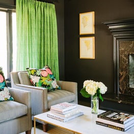 Black, Moody Living Room with Green and Coral Pops