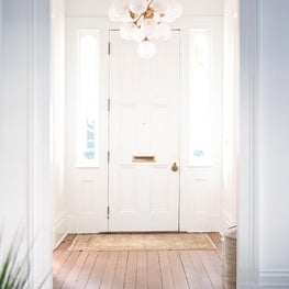 Entry Hall / Contemporary fixtures in Greek Revival entry hall