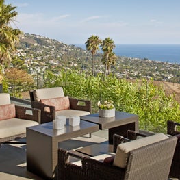 Sutherland outdoor furniture accents the wraparound deck