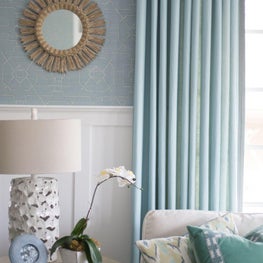 Transitional coastal blue living room with wainscoting 