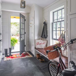 Entry and Mudroom with Shiplap and Stone Flooring