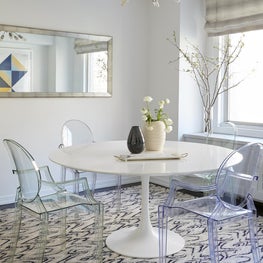 Upper East Side Dining Room with Ghost Chairs, tulip table and patterned rug