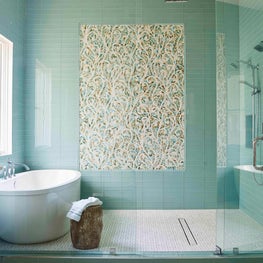 Mosaic tile by New Ravenna makes a bold statement in this Master Bath 