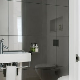 Mirrored Contemporary Powder Room, Wall Hung Sink