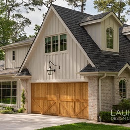 We designed the second-floor addition to this 1920s ranch-style home to blend seamlessly into the front elevation.