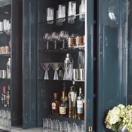 High gloss blue bar cabinet with art deco hardware