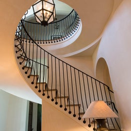 Radius Stair With Curved Wrought Iron Skirt Mounted Balusters 