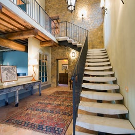 Contemporary staircase in a traditional farmhouse - magical mix