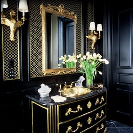 Bold vanity with French gold trim and accents.