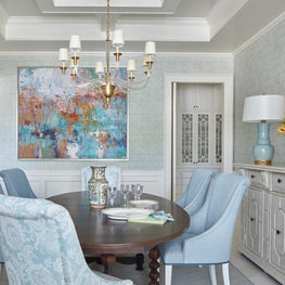 Pastel contemporary dining room with an antique mirror and traditional elements.