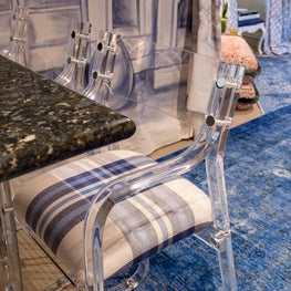 Designer House - Vintage lucite barstools give edge to this Moroccan-themed bar