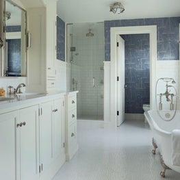 Contemporary farmhouse bathroom with clawfoot tub, blue wallpaper