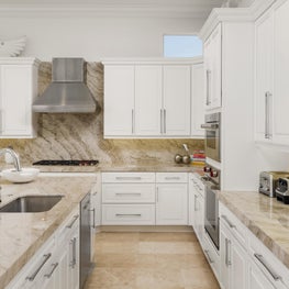 Expansive Decadent Waterfront, white kitchen, open concept kitchen, marble kitchen, marble countertops